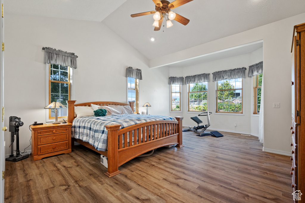 Bedroom featuring wood finished floors, lofted ceiling, recessed lighting, and ceiling fan