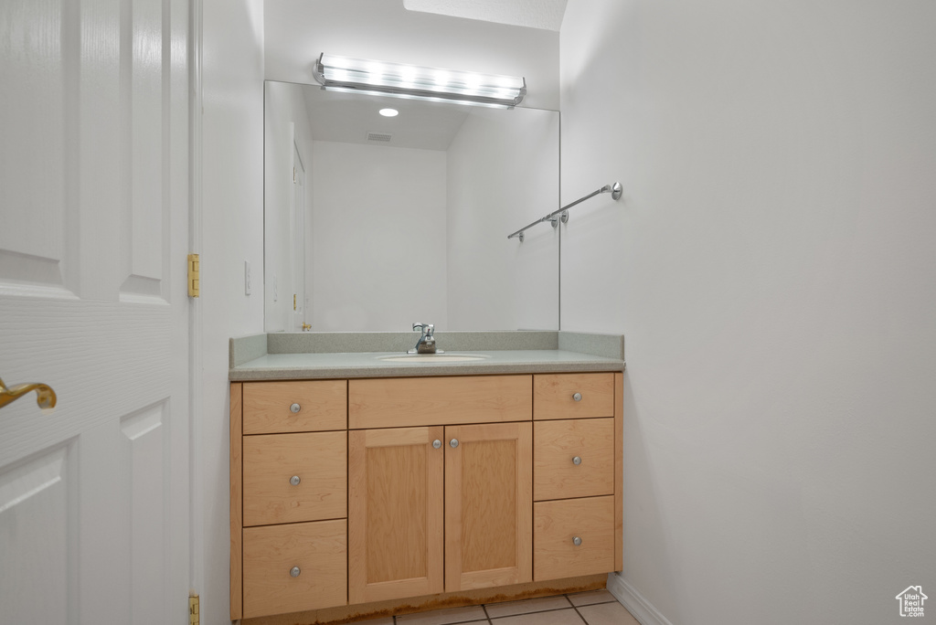 Bathroom featuring vanity and tile patterned floors