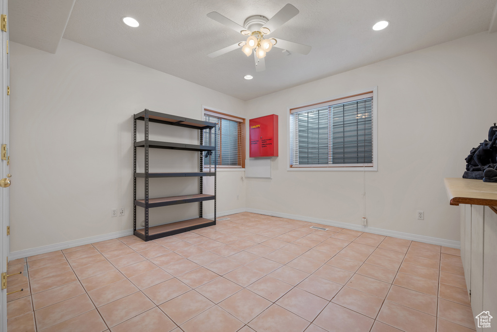 Spare room with a ceiling fan, light tile patterned floors, and recessed lighting