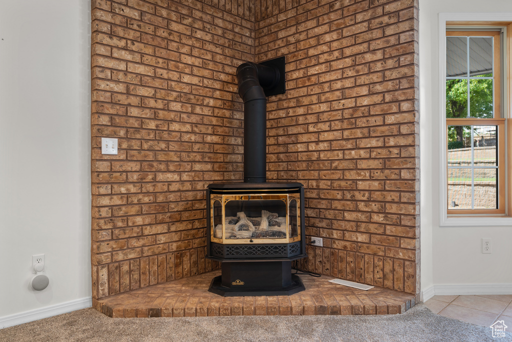 Detailed view of a wood stove and baseboards