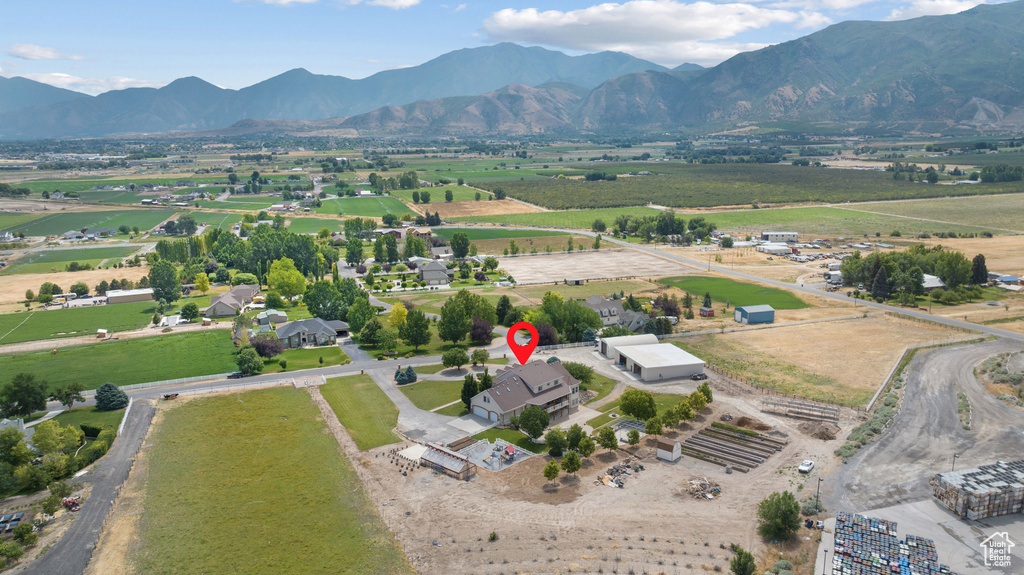 Aerial view of sparsely populated area with a mountain backdrop