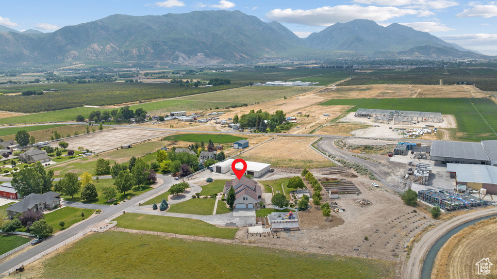 Overview of rural landscape featuring a mountainous background