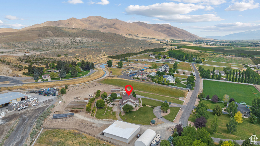 Aerial view of property and surrounding area with mountains