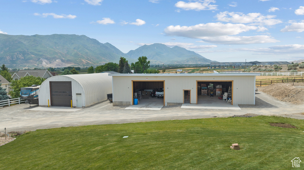 Detached garage with a mountain view