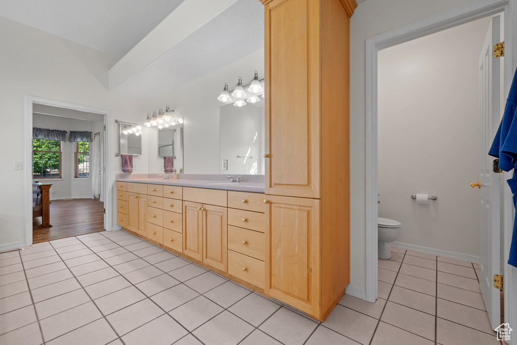 Full bathroom with tile patterned flooring and double vanity