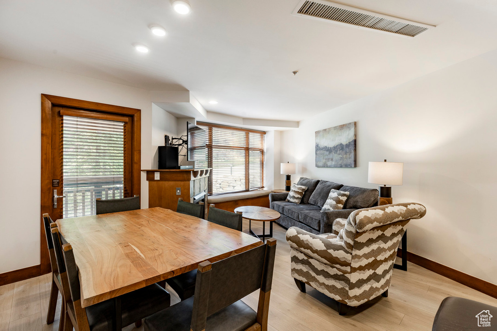 Dining space featuring light wood-style flooring and recessed lighting