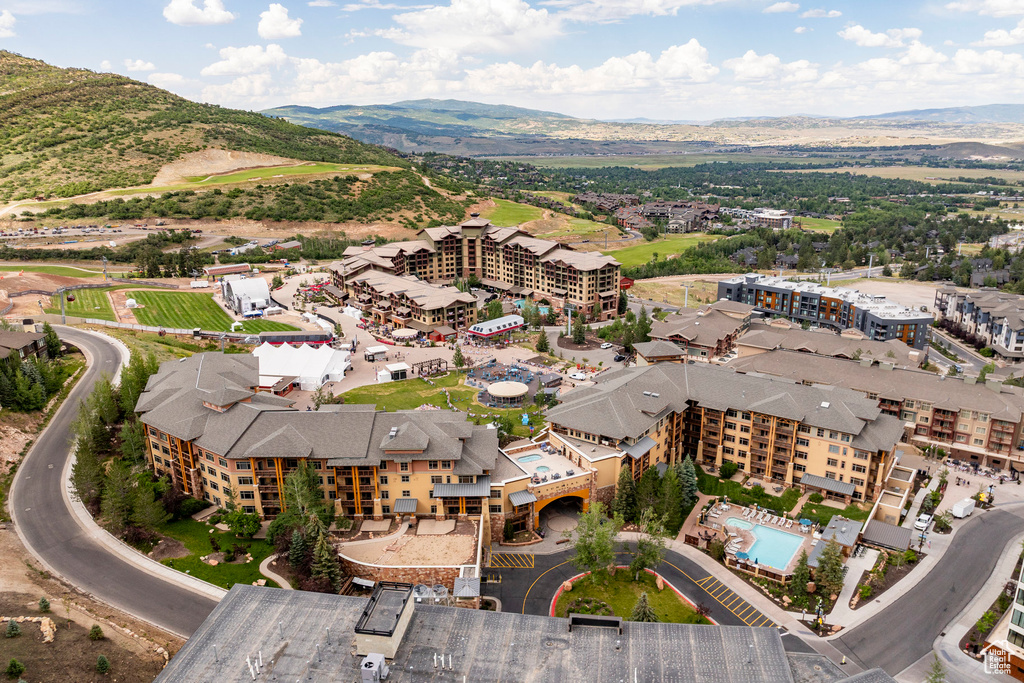 Aerial view of a mountain backdrop and a pool