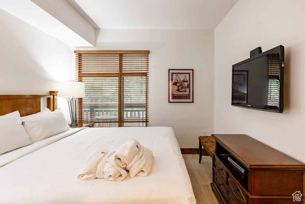 Bedroom featuring light wood-style flooring and baseboards