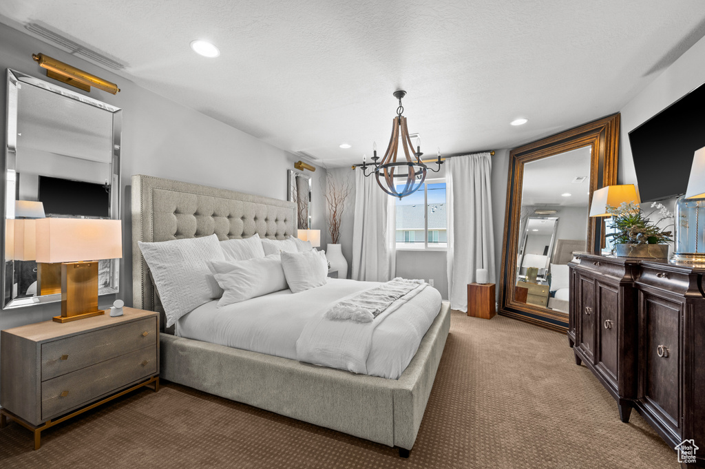 Bedroom with carpet floors, recessed lighting, and a chandelier