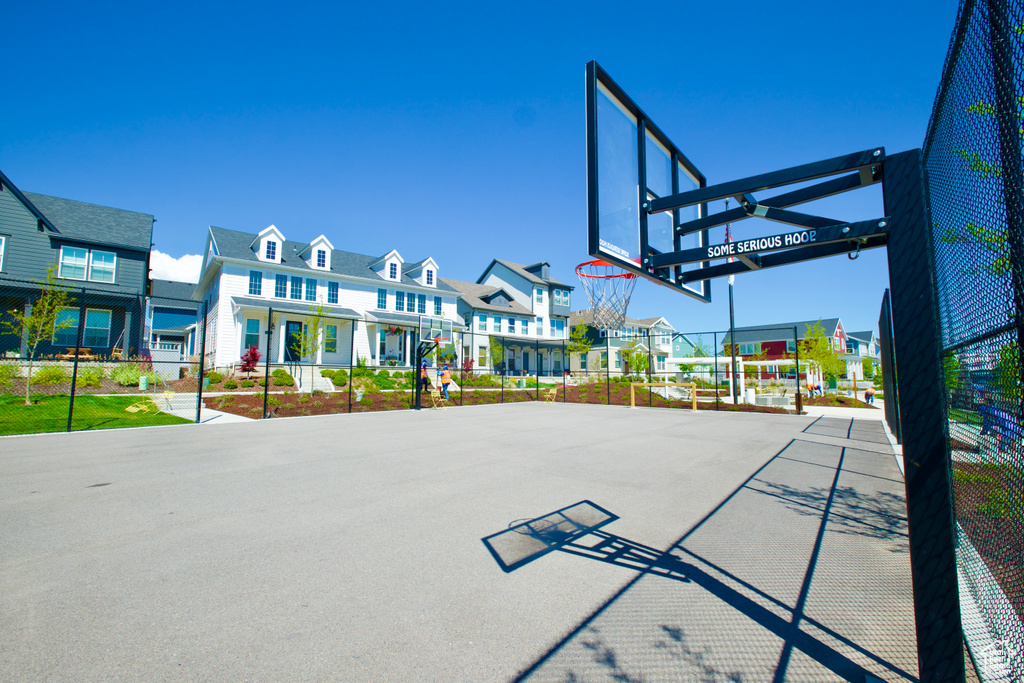 View of sport court with a residential view, community basketball court, and healthy amount of natural light