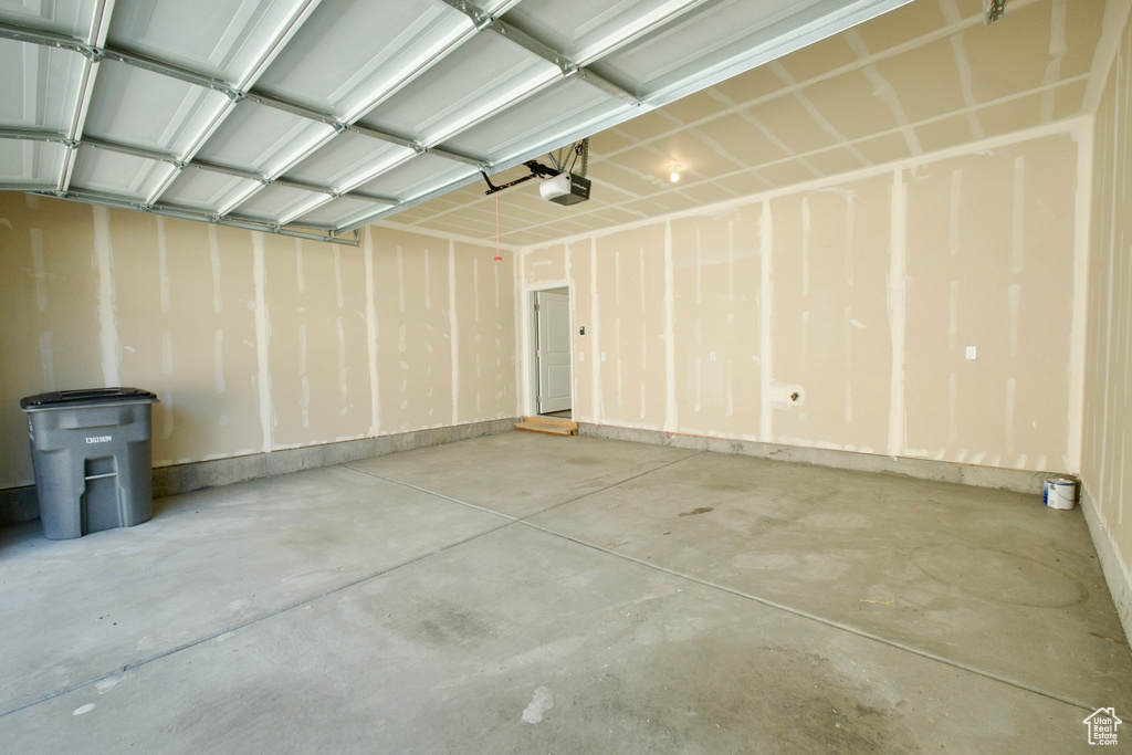 Garage featuring a garage door opener