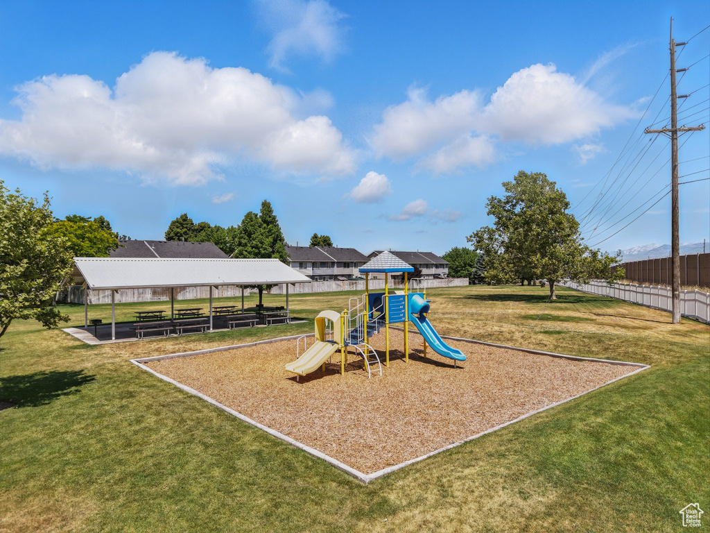 Community play area with a lawn and a gazebo