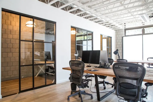 Office area with plenty of natural light and wood finished floors
