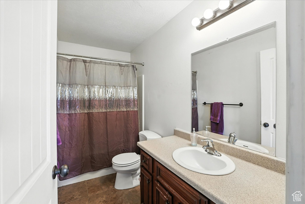 Bathroom featuring vanity and tile patterned floors