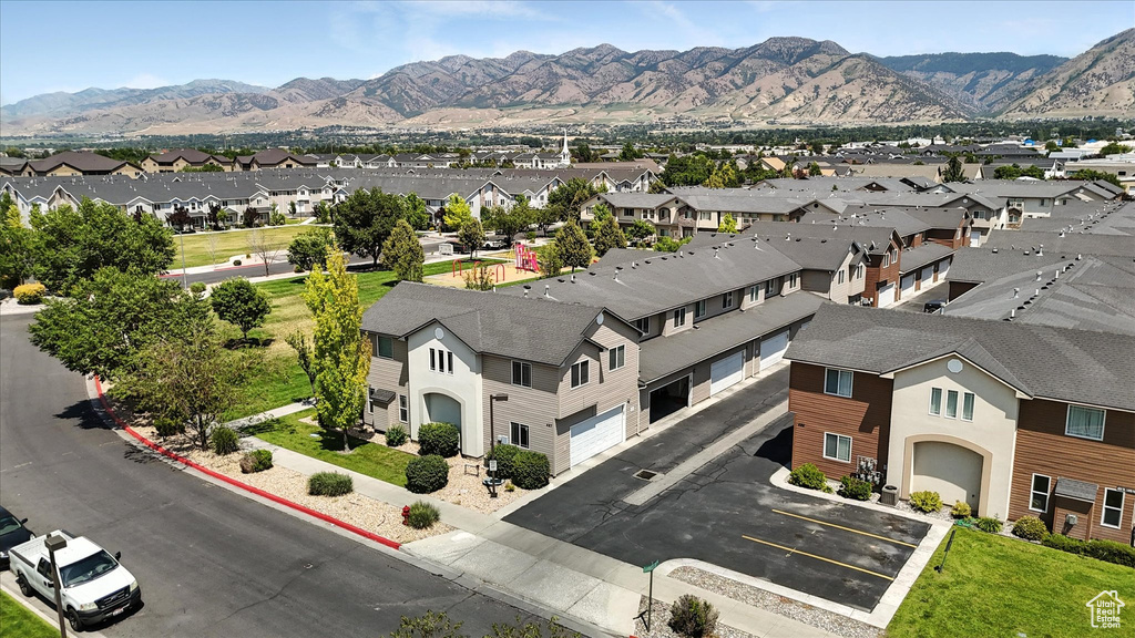 Aerial view of residential area featuring a mountain backdrop