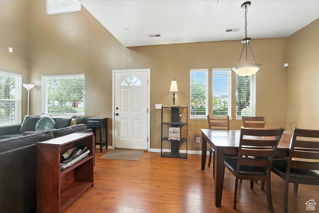 Dining room featuring wood finished floors and baseboards