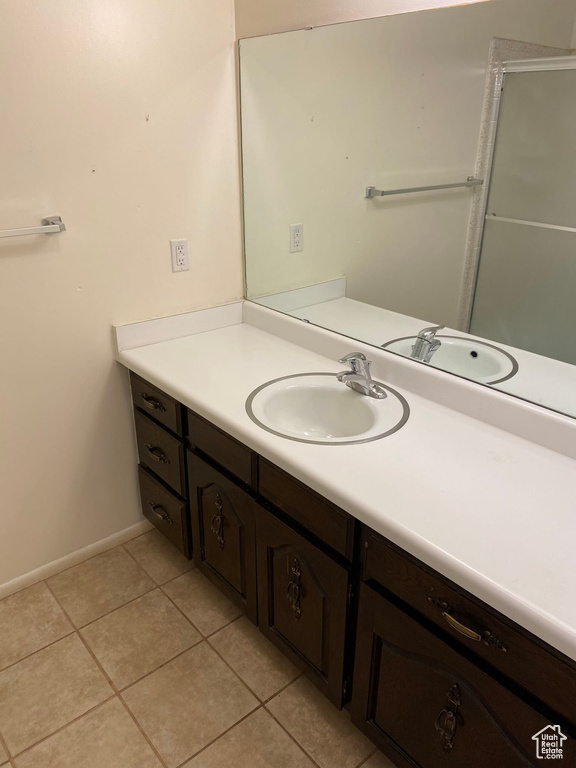 Bathroom with vanity and tile patterned floors
