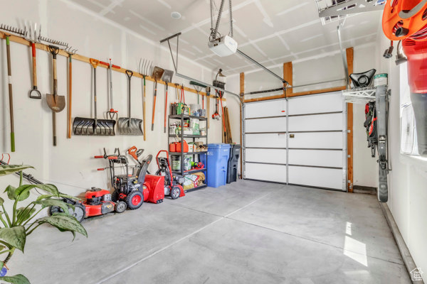 Garage featuring a garage door opener