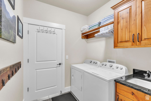 Laundry room with washer and dryer and cabinet space