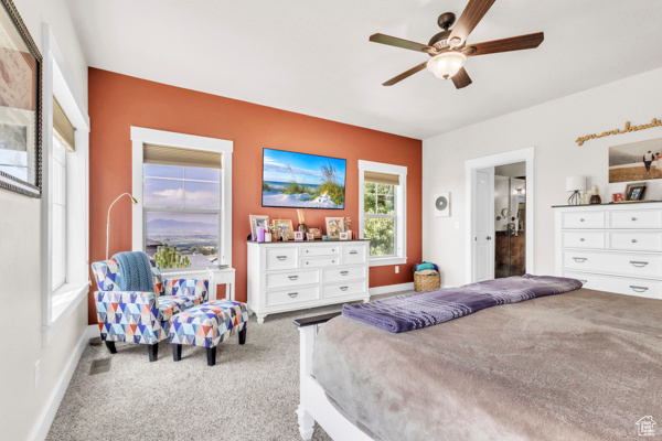 Bedroom with carpet and a ceiling fan