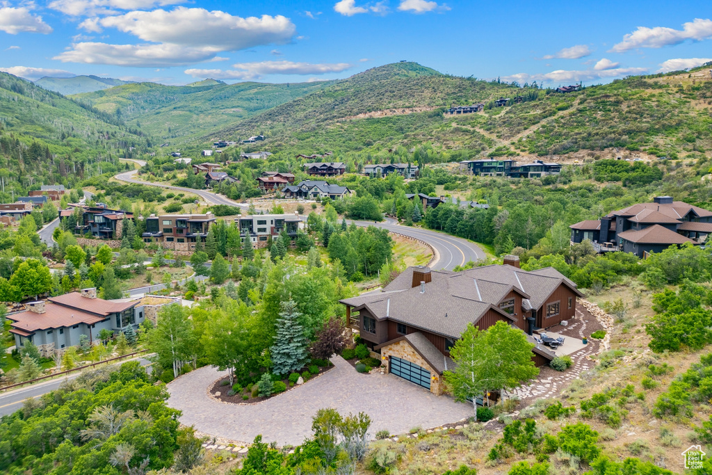 Aerial perspective of suburban area featuring a mountain backdrop