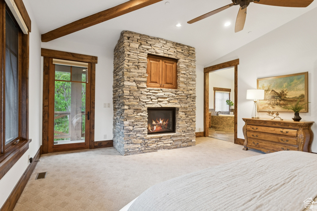 Bedroom with access to outside, light colored carpet, a fireplace, ceiling fan, and recessed lighting