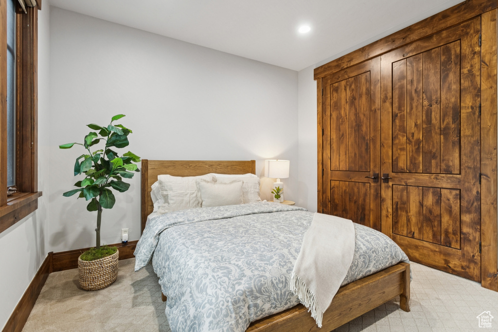 Carpeted bedroom featuring recessed lighting and baseboards