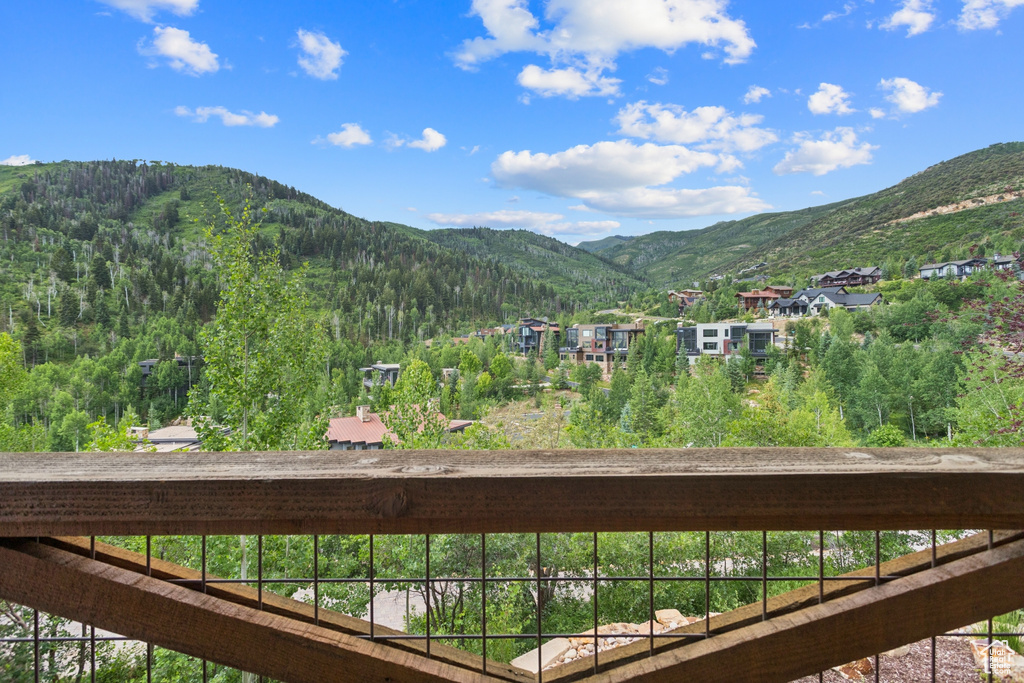 View of mountain background featuring a heavily wooded area