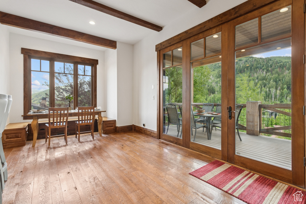 Dining area with light wood-type flooring, beamed ceiling, french doors, and recessed lighting