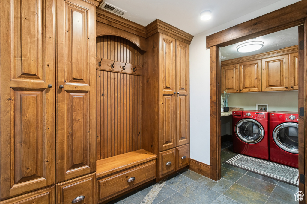 Laundry room with cabinet space and separate washer and dryer