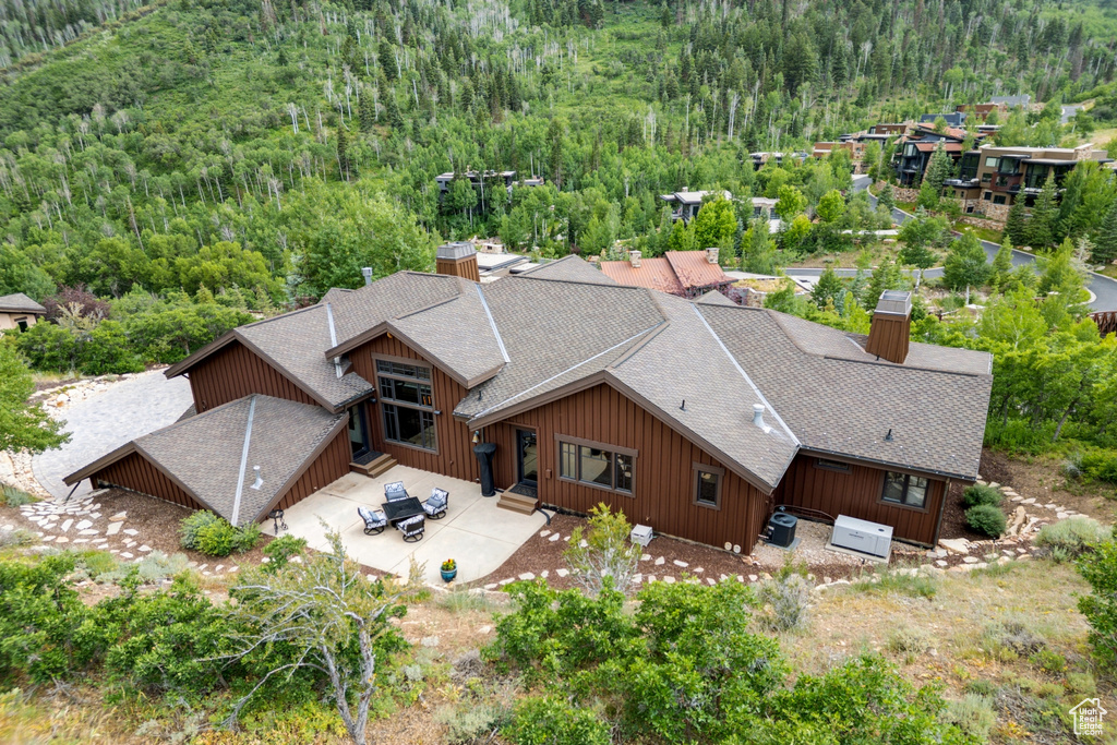 View from above of property with a heavily wooded area