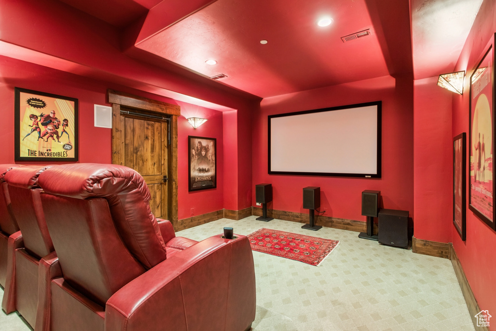 Carpeted home theater featuring recessed lighting and baseboards