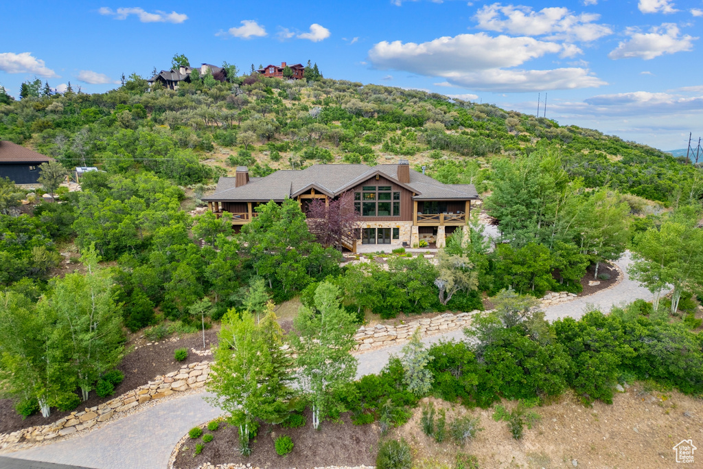 View from above of property with a heavily wooded area