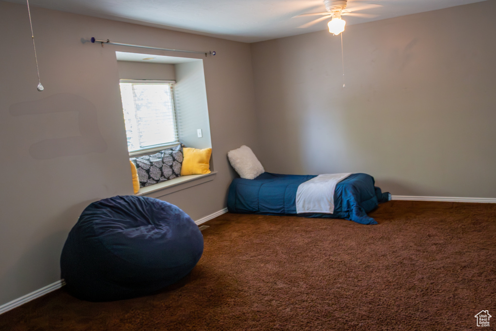 Bedroom with carpet flooring and ceiling fan