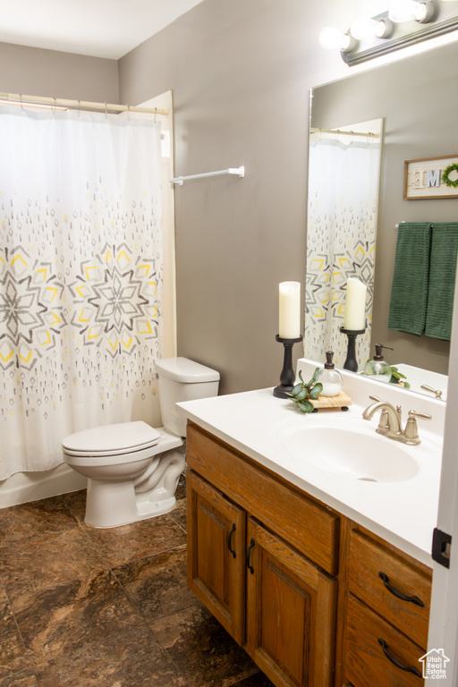 Bathroom with vanity and a shower with shower curtain
