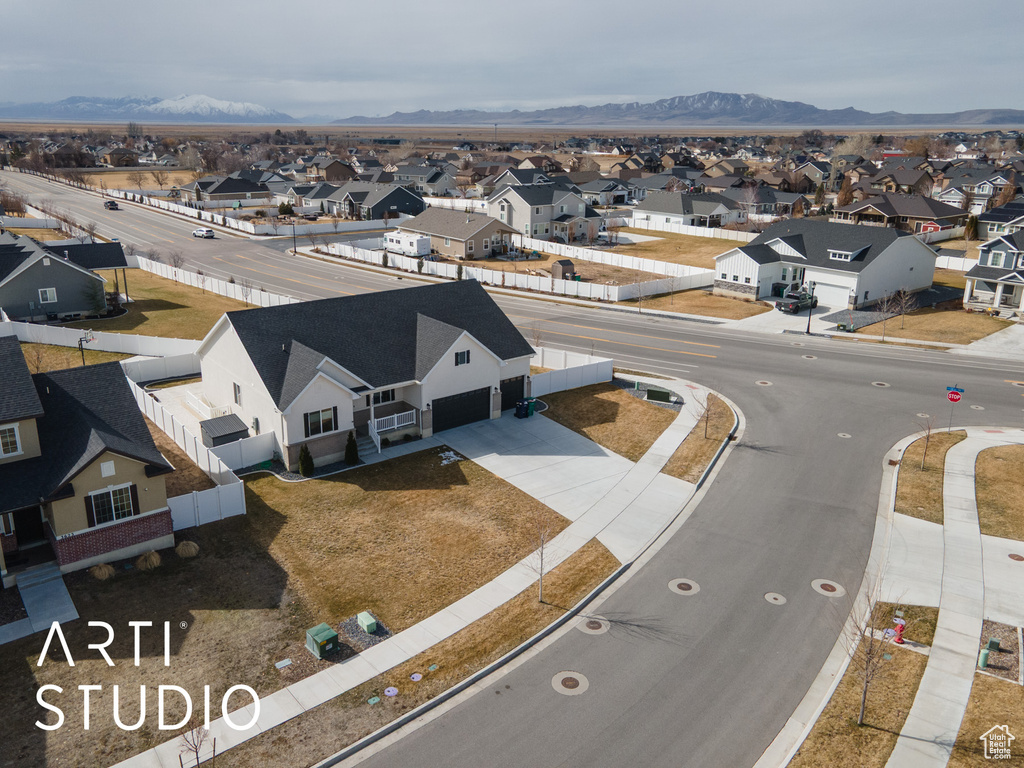 Aerial view of residential area featuring mountains