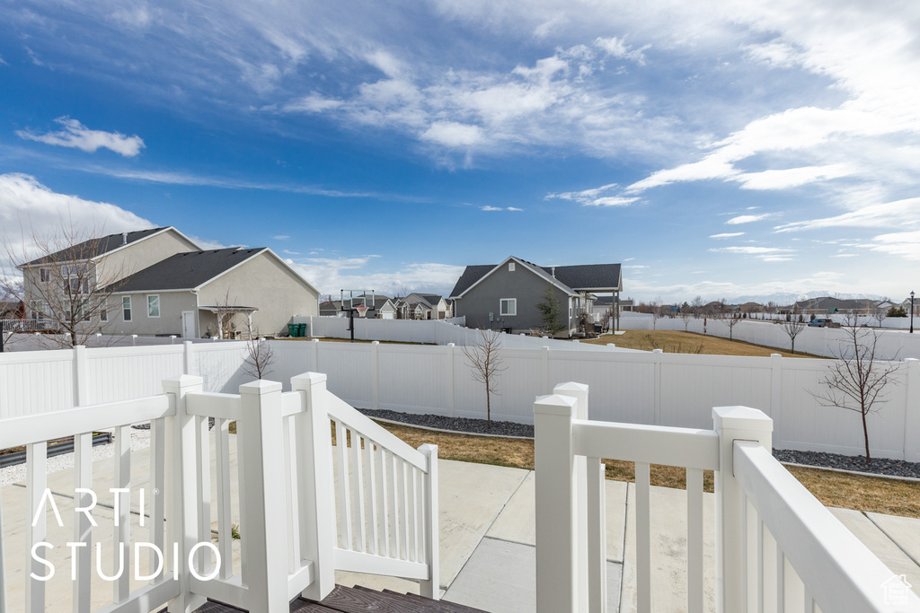 Fenced backyard with a residential view
