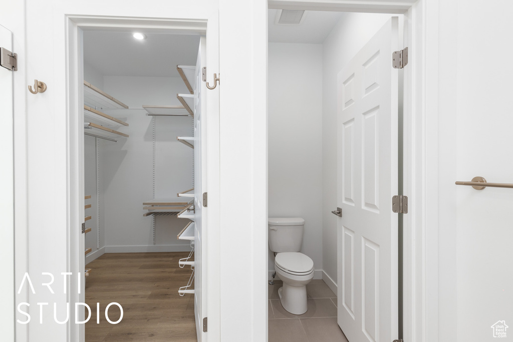 Bathroom featuring toilet and baseboards