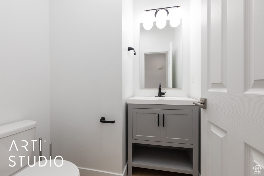 Bathroom featuring toilet and vanity