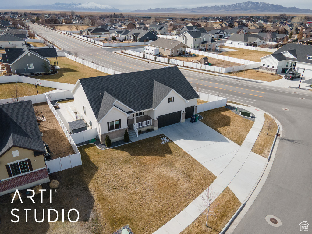 Aerial perspective of suburban area featuring a mountain backdrop