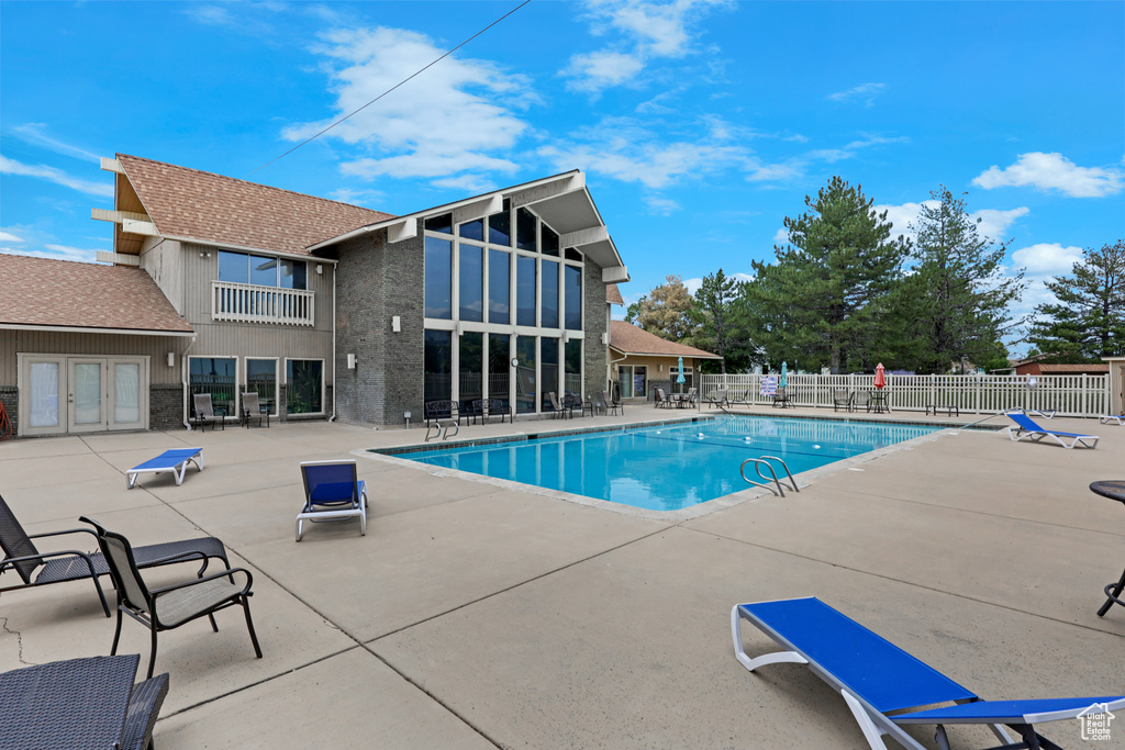 Community pool featuring a patio and french doors