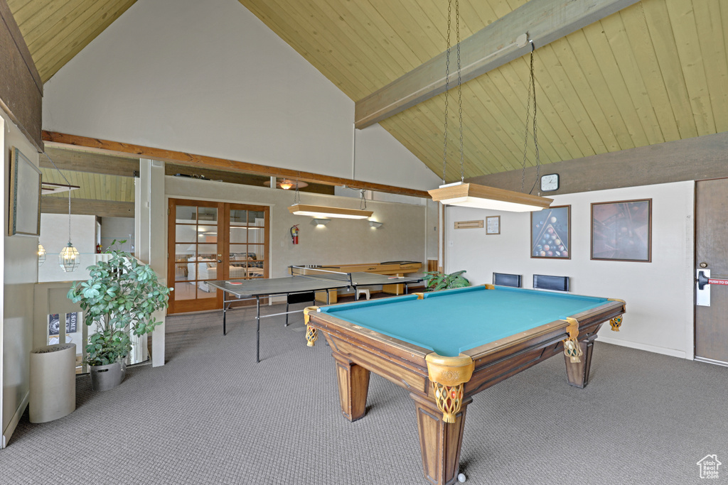 Game room featuring high vaulted ceiling, carpet floors, french doors, a wood ceiling with exposed beams, and billiards