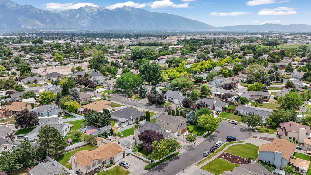 Aerial view of residential area featuring mountains