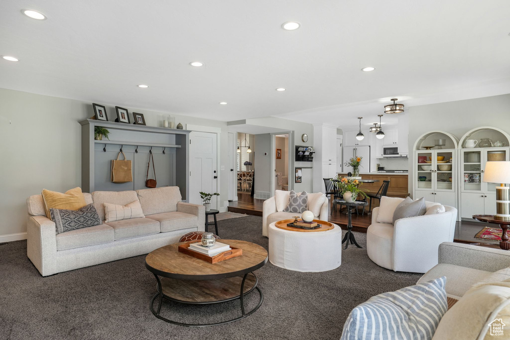 Living room featuring recessed lighting and carpet