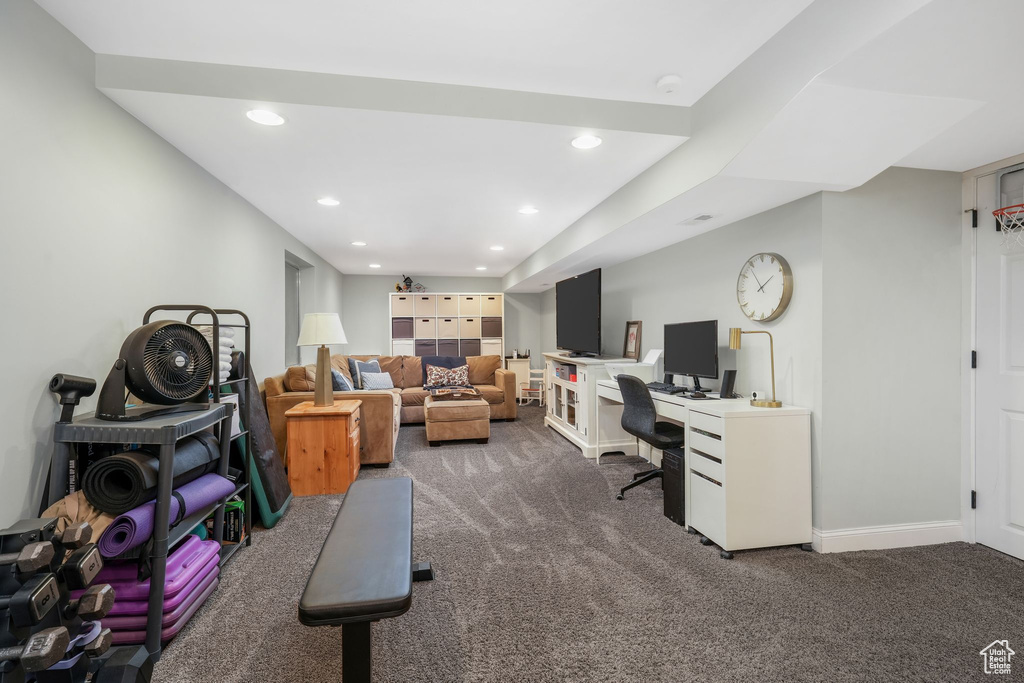 Carpeted home office featuring recessed lighting