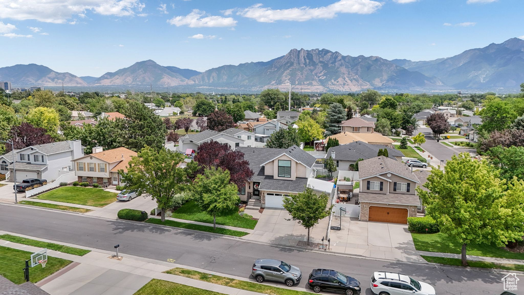 Aerial view of residential area with a mountainous background