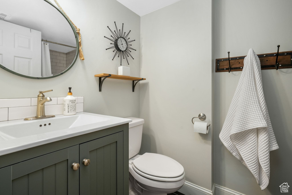 Full bath featuring vanity and a shower with curtain