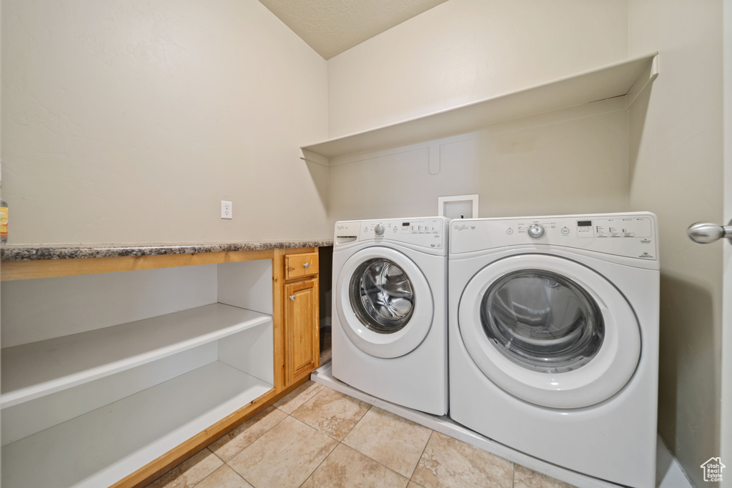 Washroom featuring washer and clothes dryer