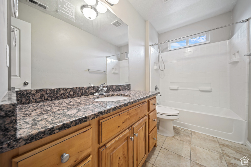 Bathroom with vanity and shower / bath combination