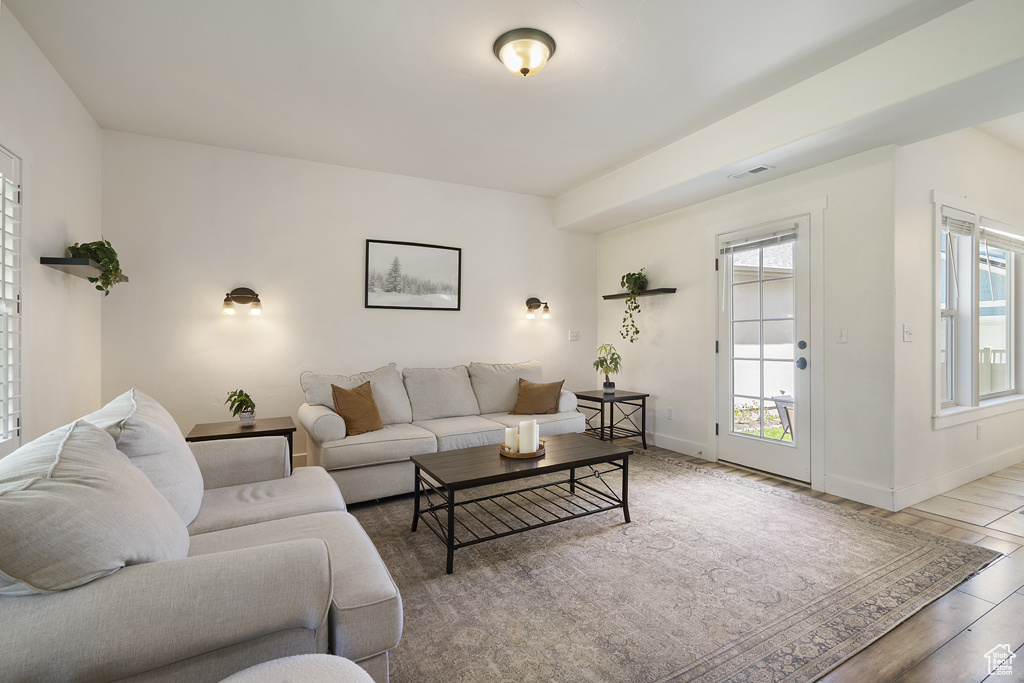 Living area featuring wood finished floors and baseboards
